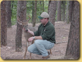 Man with a Young Whitetail Deer